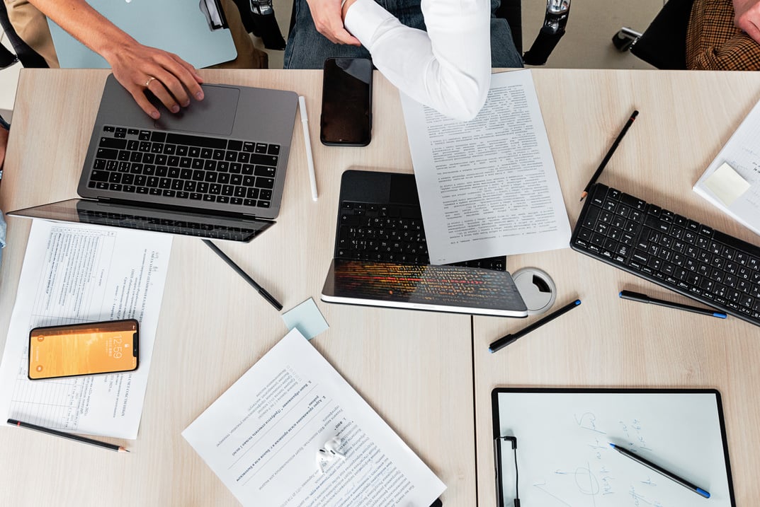 Person Using Macbook Pro on Table